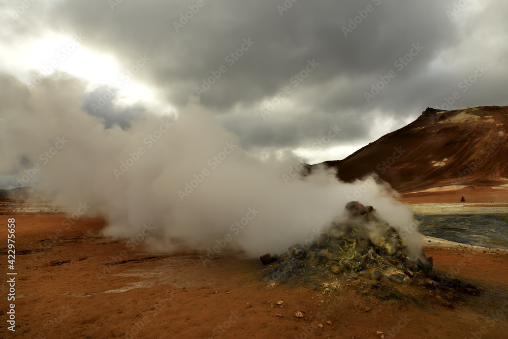 Valley with geothermal springs and geysers. Fantastic view of the hills and the current hot springs. Geothermal zones a Naumafjal Hverir in the north-eastern part of Iceland.
