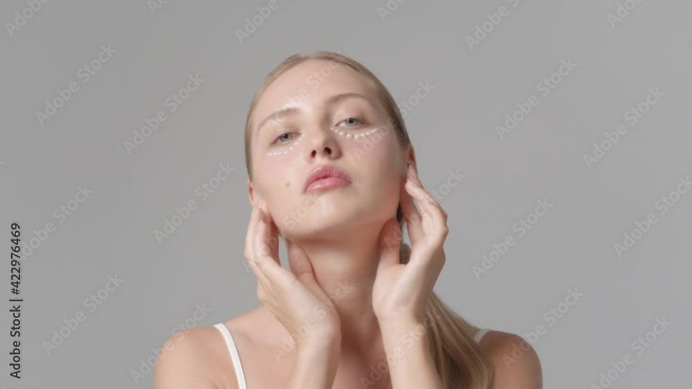 Beautiful young woman face, beauty make up with small flowers on face, problem skin, young student girl healthcare, fashion studio shot in 4k resolution Beautiful young woman face, beauty make up with small flowers on face, problem skin, young student girl healthcare, fashion studio shot in 4k resolution