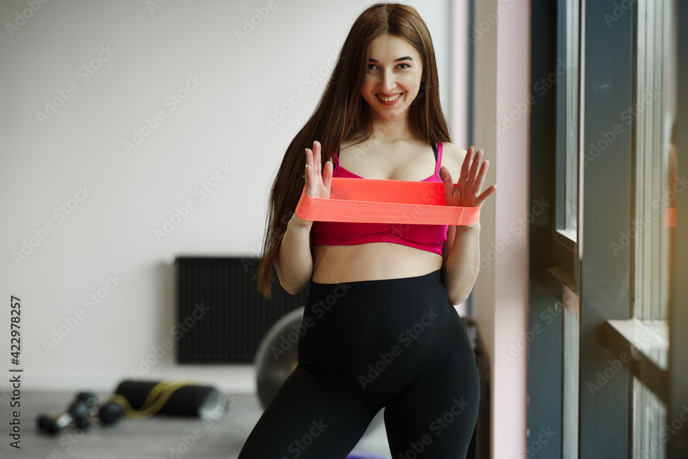 Pregnant woman doing sports in gym Pregnant woman doing sports in gym