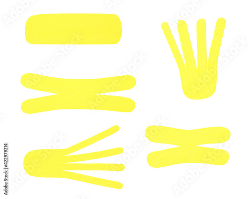 Set with yellow kinesio tapes on white background
