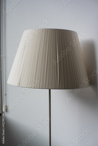 floor lamp with warm light and reflection in the window