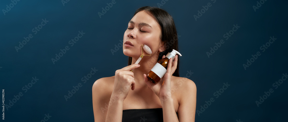 Fototapeta premium Brunette with cosmetic devices in the studio