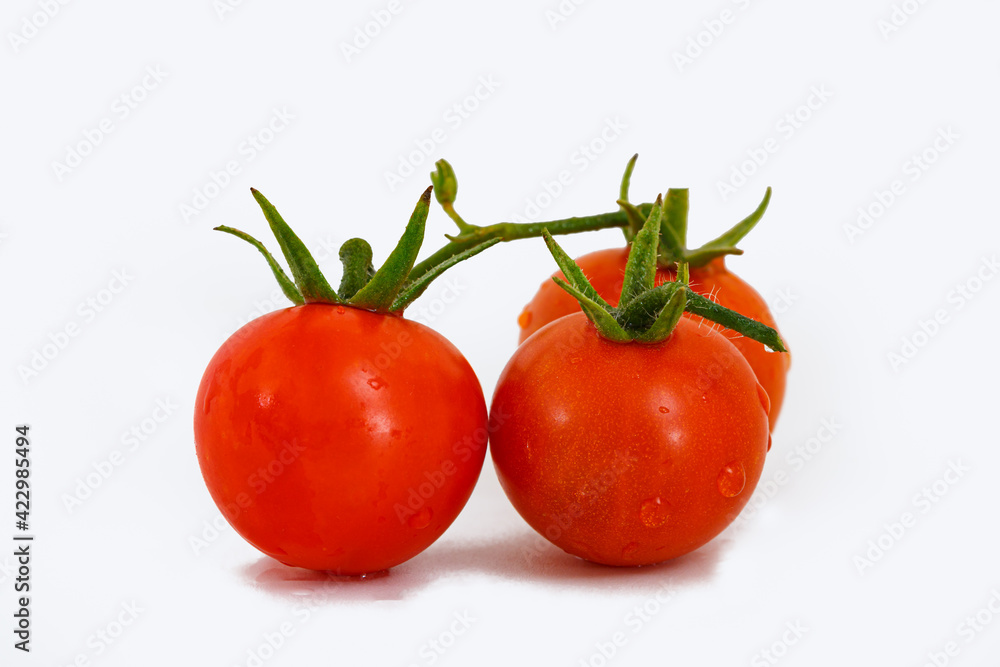 Fresh red tomatoes on a white background. Fresh red tomatoes on a white background.