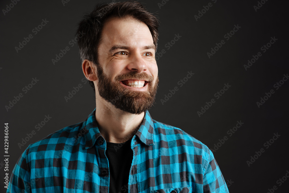 Bearded happy white man smiling and looking aside Bearded happy white man smiling and looking aside