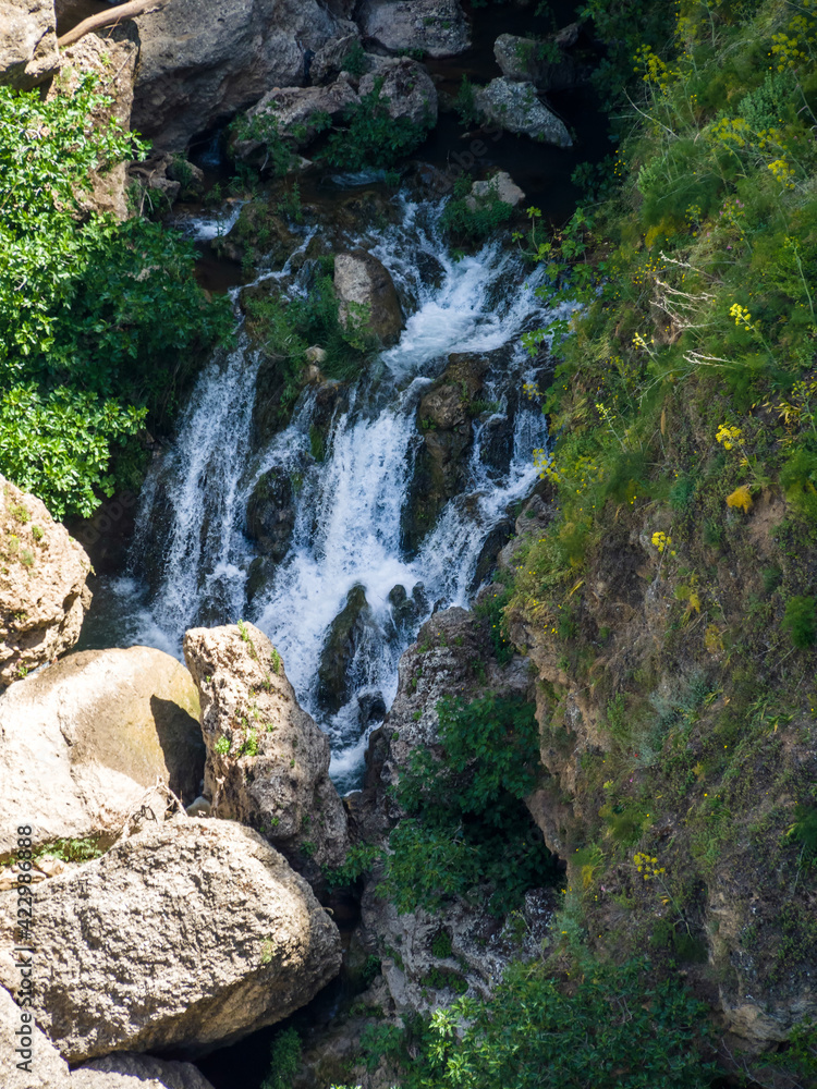 Waterfall below the New Bridge at Ronda Spain Waterfall below the New Bridge at Ronda Spain