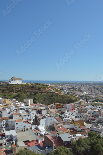 Remedios hermitages with Velez Malaga city and the sea at background a sunny day photo