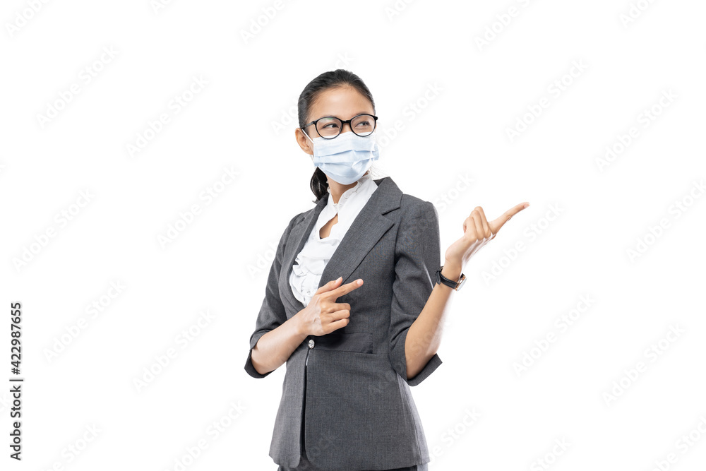 Beautiful Business Woman pointing something on white background and wearing health mask Beautiful Business Woman pointing something on white background and wearing health mask