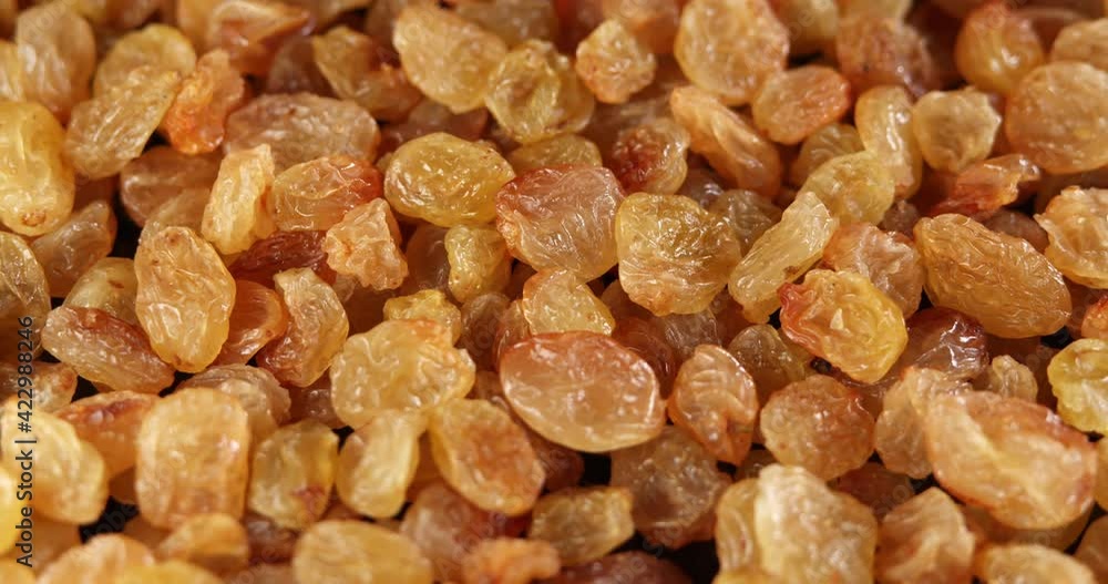 Raisins background rotate slowly. Sweet raisins slow sliding. Close up food background. Gastronomy concept, organic food. Macro fruit dolly shot. Assorted colorful raisins, close up. Raisins background rotate slowly. Sweet raisins slow sliding. Close up food background. Gastronomy concept, organic food. Macro fruit dolly shot. Assorted colorful raisins, close up.