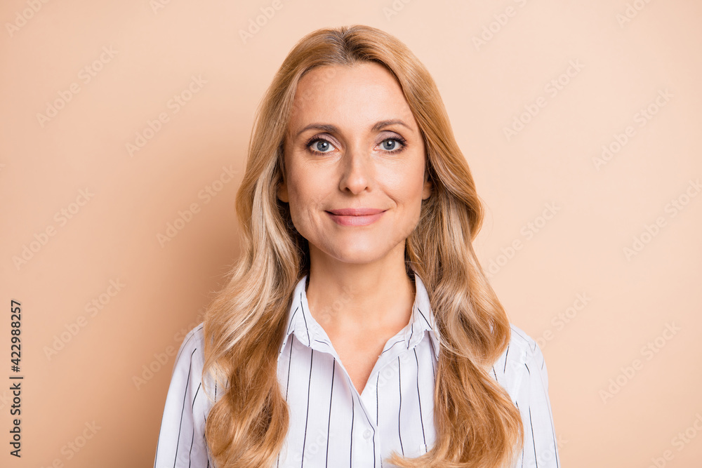 Fototapeta premium Photo of adorable pretty mature woman dressed white shirt smiling isolated beige color background