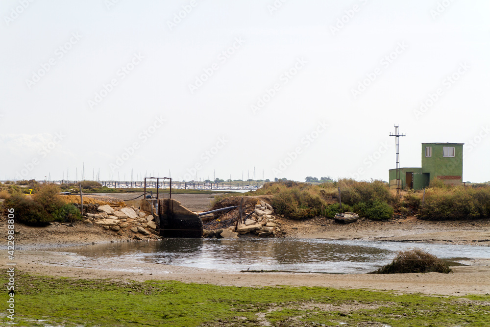 Compuerta o Gate en el Paraje Natural Marismas del Río Piedras y Flecha del Rompido, municipio de Cartaya, provincia de Huelva, comunidad autonoma de Andalucia, pais de España Compuerta o Gate en el Paraje Natural Marismas del Río Piedras y Flecha del Rompido, municipio de Cartaya, provincia de Huelva, comunidad autonoma de Andalucia, pais de España
