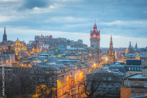 Cityscape night view from Calton Hill of illuminated Edinburgh old town skyline, Princes Street, Balmoral Clock Tower and Edinburgh Castle in the capital city of Scotland.