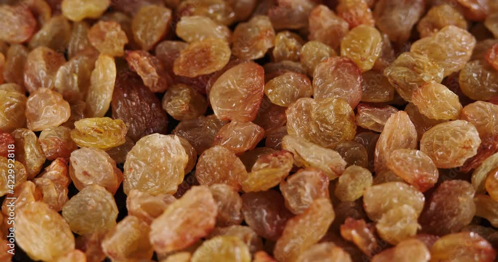 Raisins background rotate slowly. Sweet raisins slow sliding. Close up food background. Gastronomy concept, organic food. Macro fruit dolly shot. Assorted colorful raisins, close up. Raisins background rotate slowly. Sweet raisins slow sliding. Close up food background. Gastronomy concept, organic food. Macro fruit dolly shot. Assorted colorful raisins, close up.