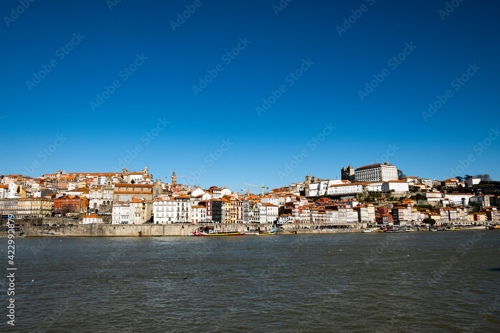 Porto, Portugal Old city skyline from across the Douro river on a Sunny warm day