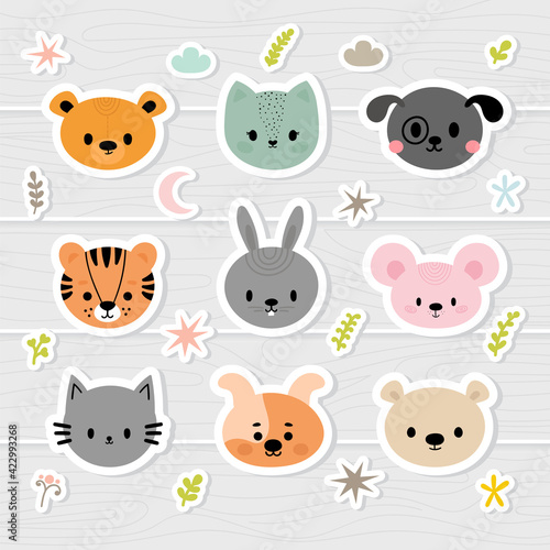 Set of cartoon stickers with animals for kids. Sweet smiley faces. Cute hand drawn characters with design elements