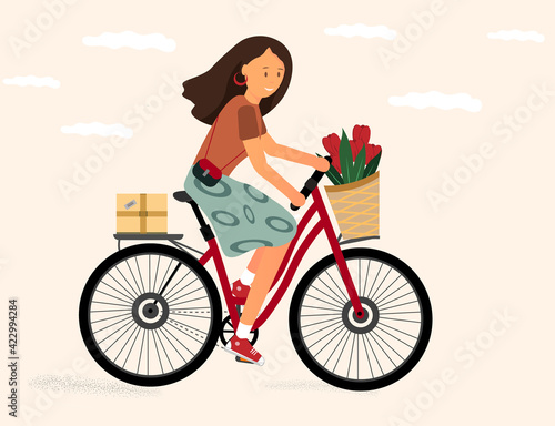 Smiling girl riding bicycle with flower bouquet in front basket. Cute happy young woman on bike, flat vector illustration