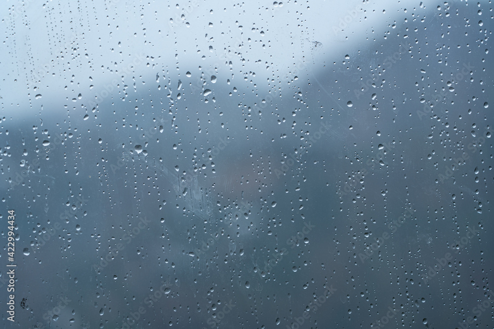 Raindrops on glass as an abstract background Raindrops on glass as an abstract background