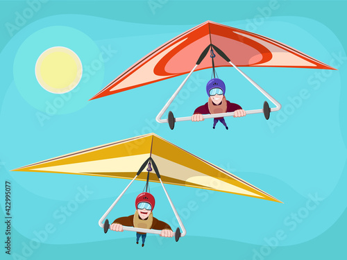 Hang Glider in Helmet and Uniform Soaring Thermal Updrafts Suspended on Harness Below the Wing. Smiling man flying on hang-glider.