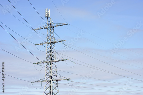 Electricity pole for transportation of electricity with a antenna on top