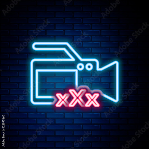 Glowing neon line Video camera with inscription Sex icon isolated on brick wall background. Age restriction symbol. 18 plus content sign. Adult channel. Colorful outline concept. Vector