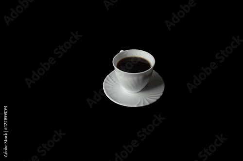 isolated cup of coffee on a black background
