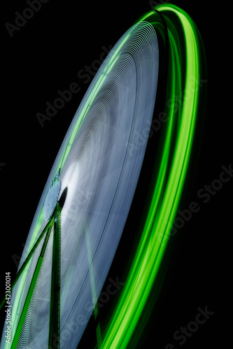 Play of lights at a carnival. Big Wheel. Long exposure photography. 