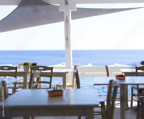 Restaurant furnishings outside with view of the ocean © Gazza_M