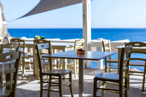 Restaurant furnishings outside with view of the ocean © Gazza_M