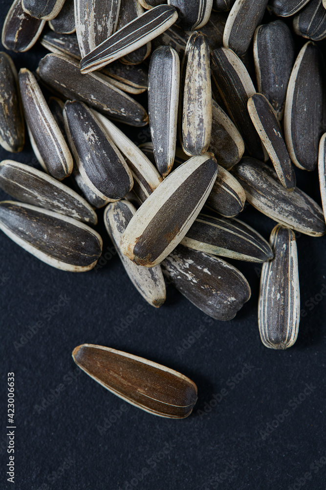 a pile of fresh roasted striped sunflower seeds
