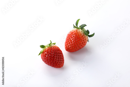 Close-up photo of fresh strawberry on white backgroung