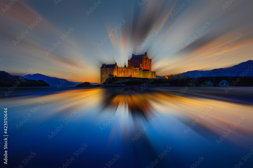 eilean donan castle with blurred sky and water, located in the highlands, scotland.