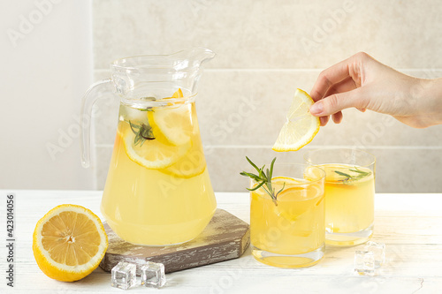 Summer citrus lemonade with orange, lemon and rosemary