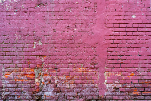 Brick wall painted pink. Background texture.