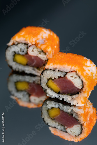 Wallpaper Mural Sushi rolls with salmon avocado tuna and mango in a black background Torontodigital.ca