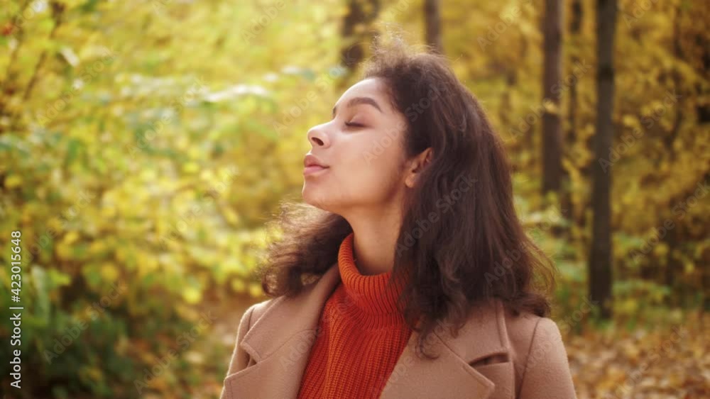 African American woman walking in autumn fall park, safe travel and explore, walk hiking tours, black tourist in wild forest, generation z lifestyle, teenager fashion portrait African American woman walking in autumn fall park, safe travel and explore, walk hiking tours, black tourist in wild forest, generation z lifestyle, teenager fashion portrait