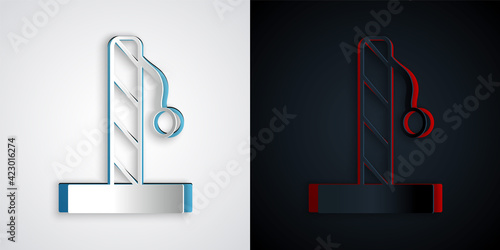 Paper cut Cat scratching post with toy icon isolated on grey and black background. Paper art style. Vector