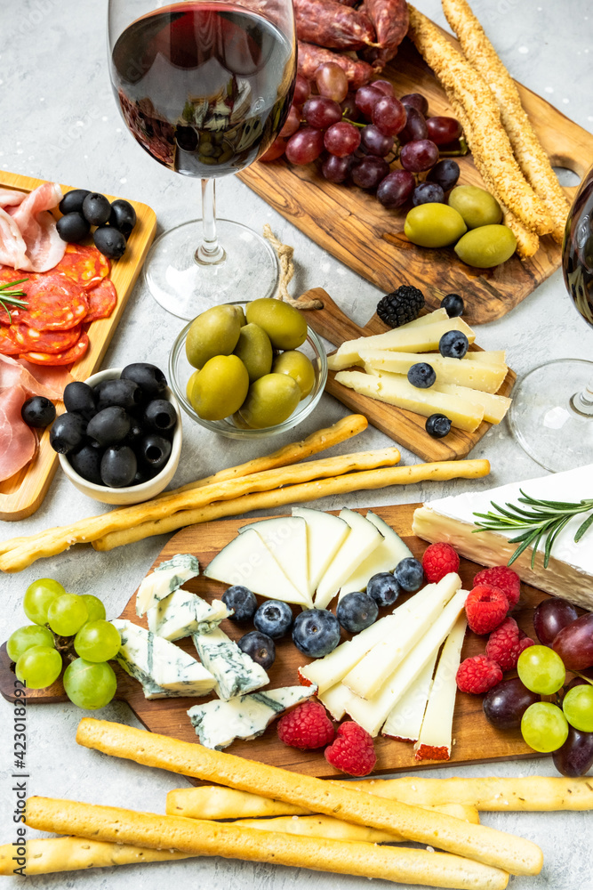 Charcuterie board with pork sausage with pepper, salami, cheese and