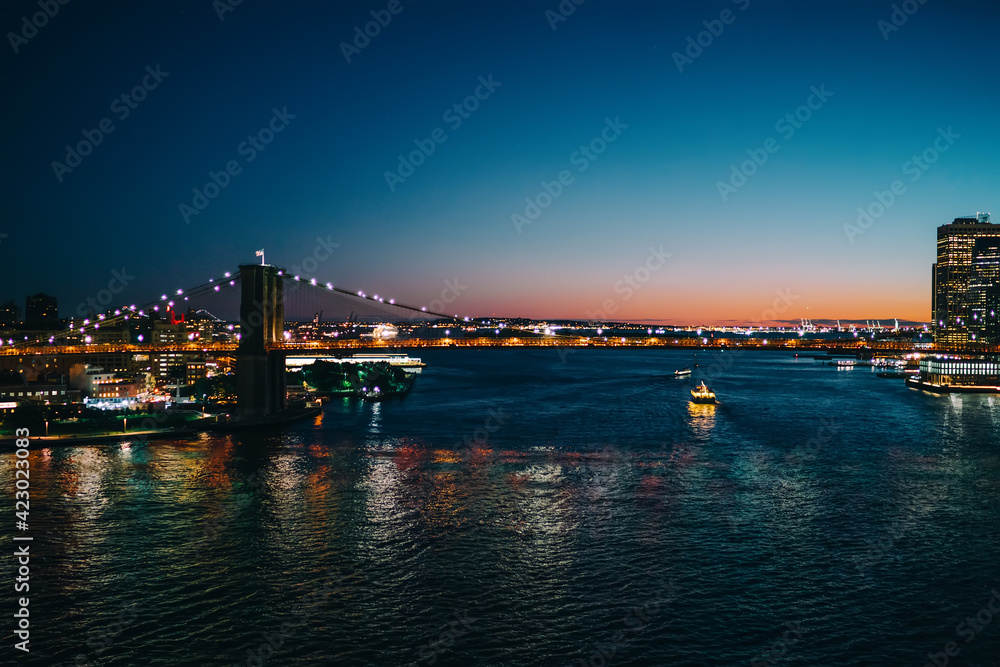 Brooklyn bridge illuminated at dusk