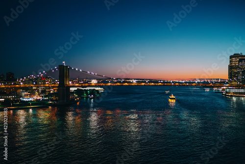 Brooklyn bridge illuminated at dusk