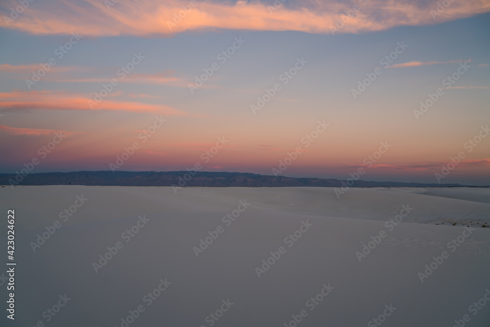 Sunset in empty white sand valley