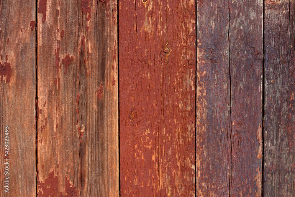 Old wooden background. Colorful planks with scratched paint. Weathered wood close up.
