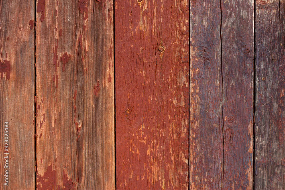 Old wooden background. Colorful planks with scratched paint. Weathered wood close up. Old wooden background. Colorful planks with scratched paint. Weathered wood close up.
