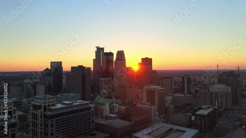 sun setting down behind buildings in minneapolis downtown aerial footage, explore Minnesota cityscapes meet minneapolis, msp photo