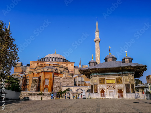 Istanbul, Turkey - October 29, 2019: City Square with Fountain of Ahmed III and Hagia Sophia in Istanbul. Ancient tourist attractions in Sultanahmet district photo