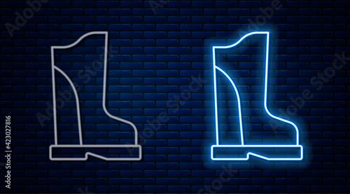 Glowing neon line Waterproof rubber boot icon isolated on brick wall background. Gumboots for rainy weather, fishing, gardening. Vector