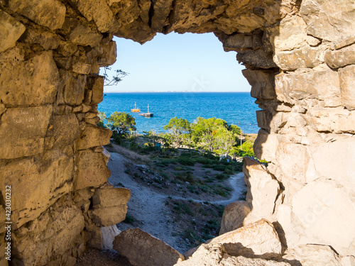 View of the sea through a gap in the wall of the Genoese fortress, Feodosia, Crimea