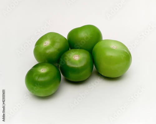 Fresh organic green tomatillos (Physalis philadelphica) on white background