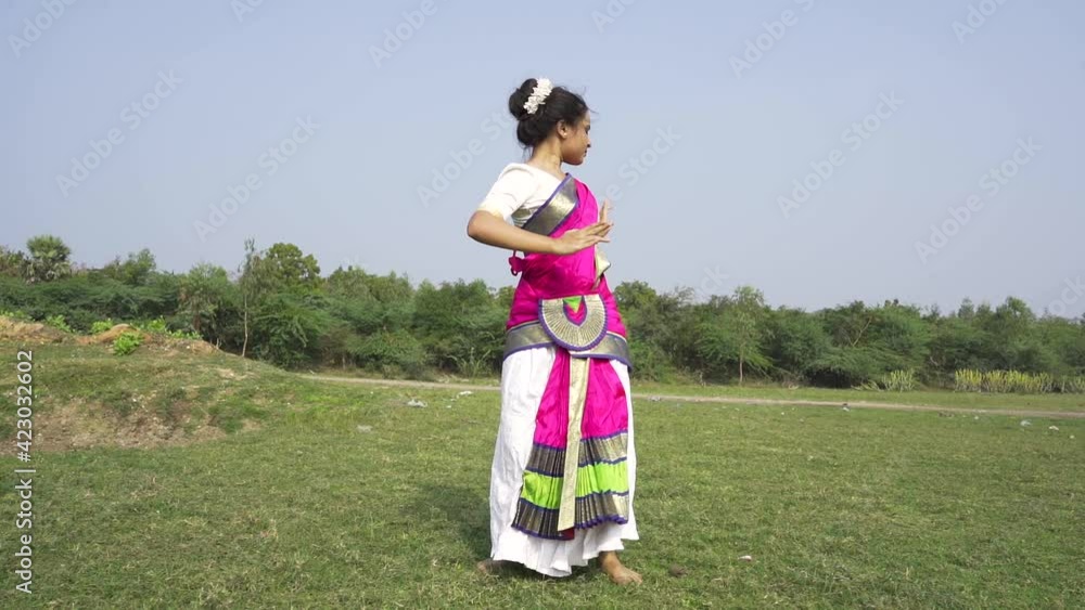 A bharatnatyam dancer displaying a classical bharatnatyam pose in the nature of Vadatalav lake, Pavagadh. Beautiful indian girl dancer in the posture of Indian classical dance bharatanatyam . A bharatnatyam dancer displaying a classical bharatnatyam pose in the nature of Vadatalav lake, Pavagadh. Beautiful indian girl dancer in the posture of Indian classical dance bharatanatyam .