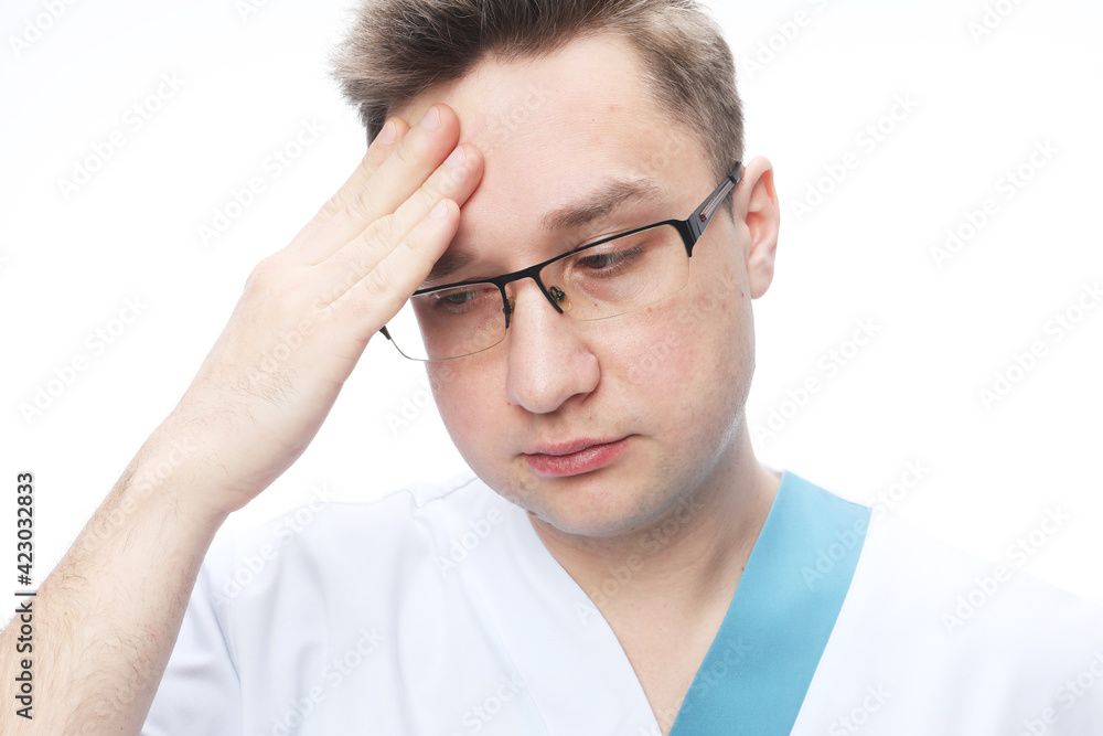 Medicine COVID-19 concept. Handsome doctor man wearing medical uniform over white background tired rubbing forehead, feeling fatigue and headache. Medicine COVID-19 concept. Handsome doctor man wearing medical uniform over white background tired rubbing forehead, feeling fatigue and headache.