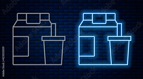 Glowing neon line Online ordering and fast food delivery icon isolated on brick wall background. Vector