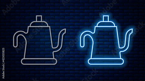 Glowing neon line Watering can icon isolated on brick wall background. Irrigation symbol. Vector